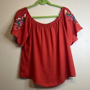 Lily White, rust colored embroidered top. (A-20)